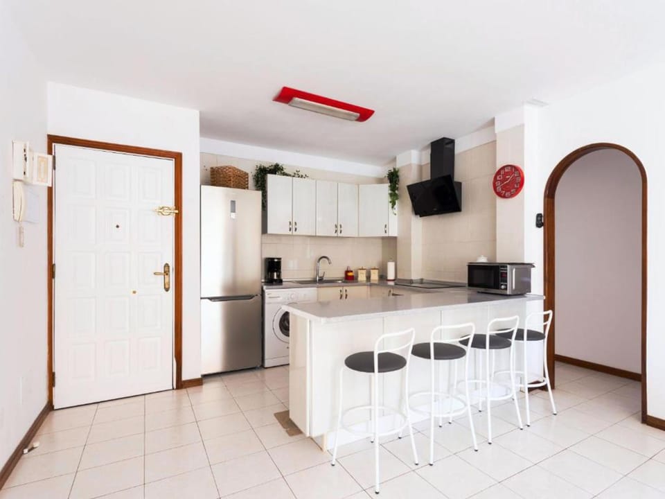 Kitchen or kitchenette, microwave, stove, washing machine