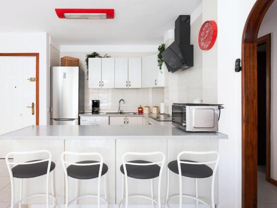 Kitchen or kitchenette, microwave, stove