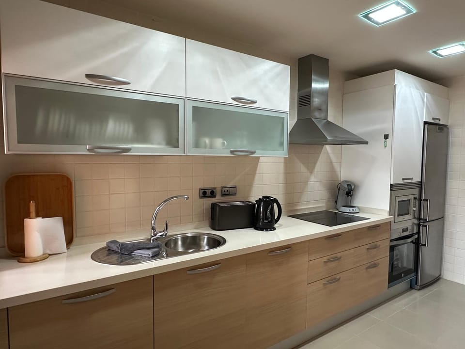 Kitchen or kitchenette, dishwasher, oven, stove, toaster