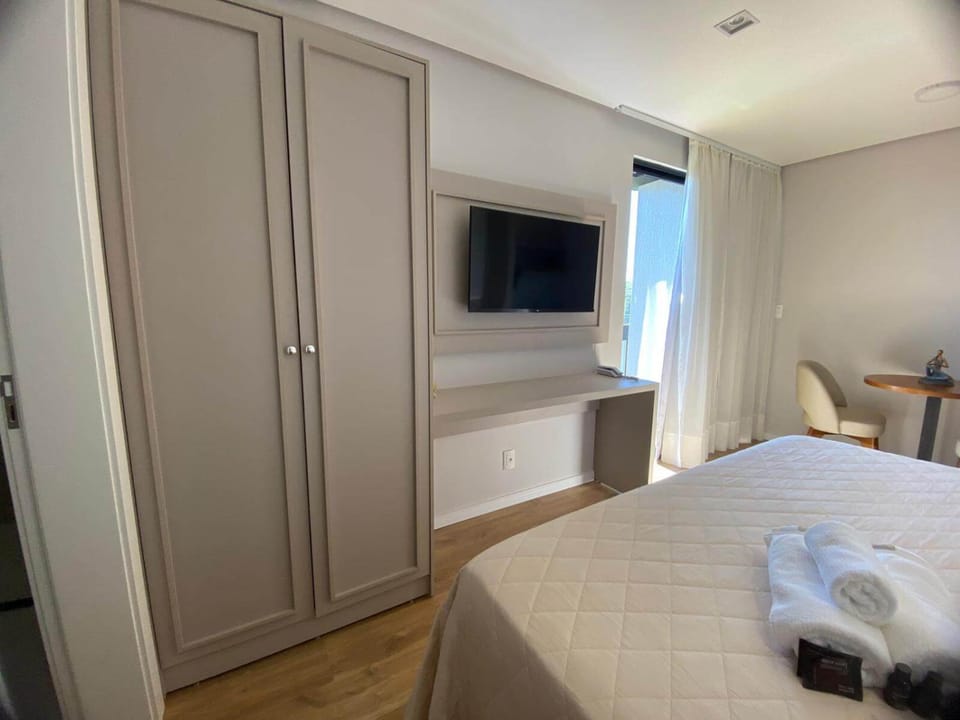 Bed, towels, wardrobe