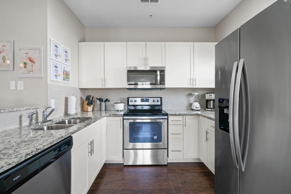 Kitchen or kitchenette, dishwasher, oven, stove, toaster