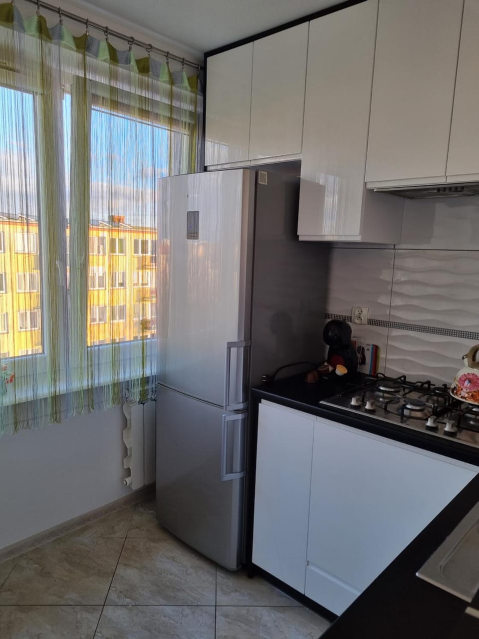 Kitchen or kitchenette, dishwasher, oven, stove