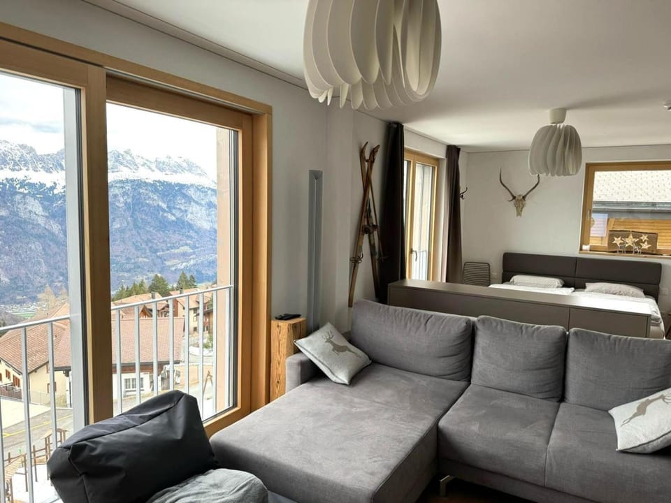Bed, Natural landscape, View (from property/room), Living room, Seating area, Bedroom, Mountain view