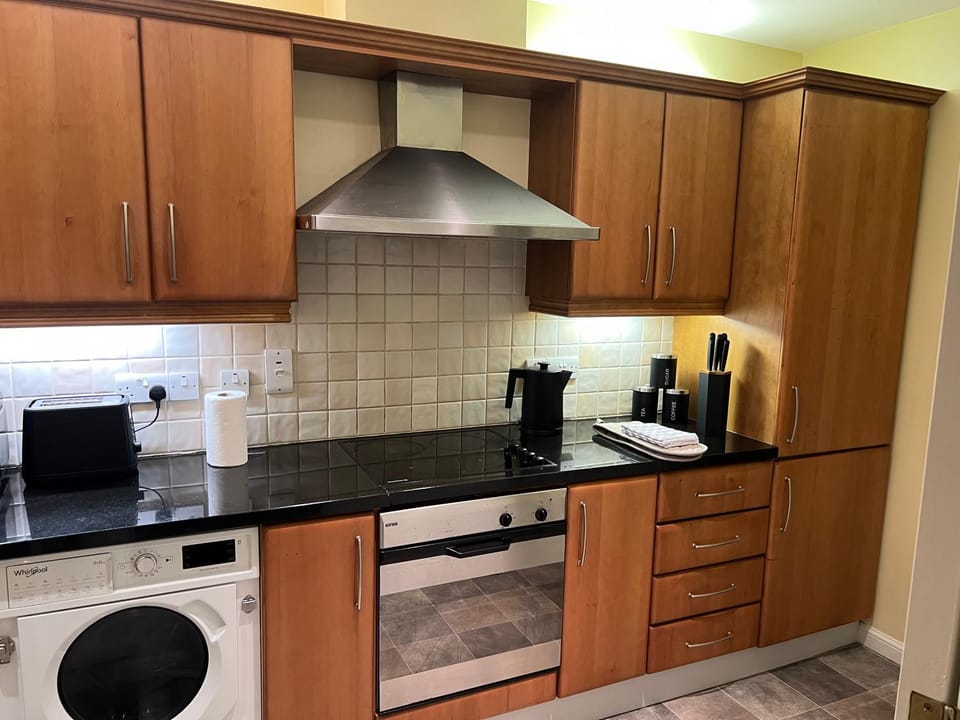 Kitchen or kitchenette, dishwasher, oven, stove, toaster