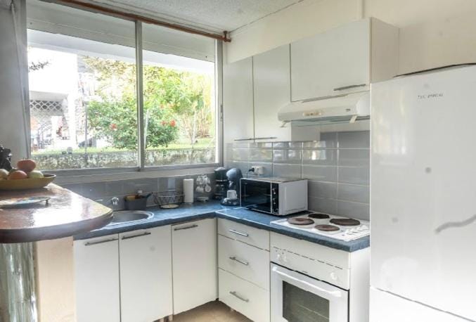 Kitchen or kitchenette, oven, stove, toaster