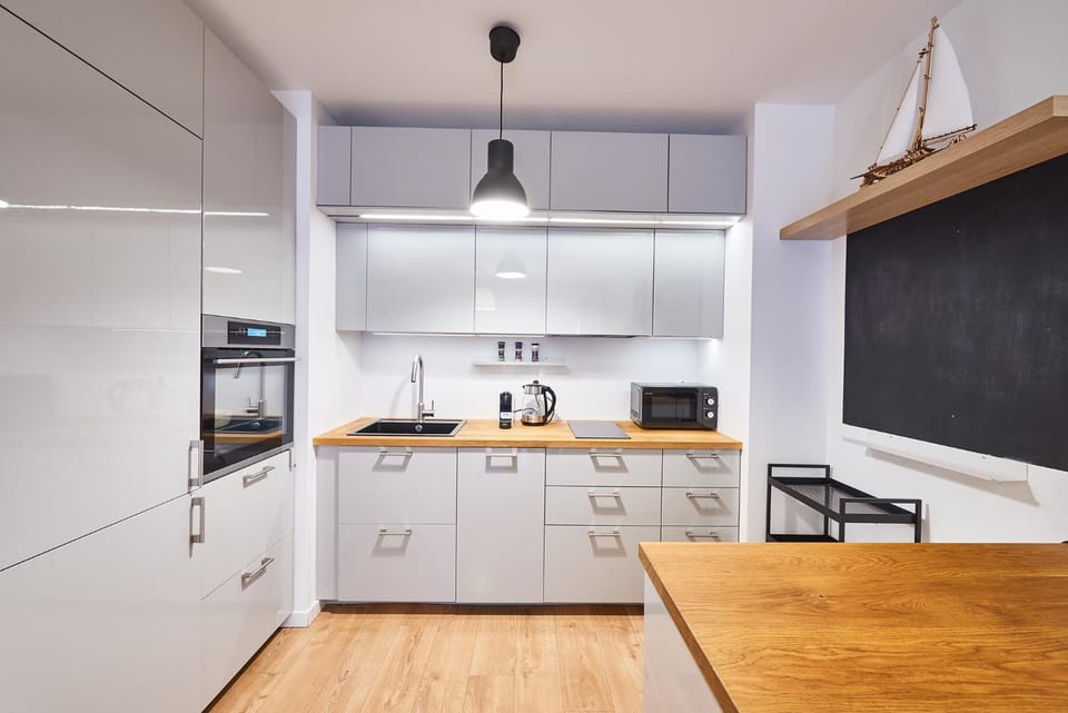 Kitchen or kitchenette, dishwasher, oven, stove, toaster