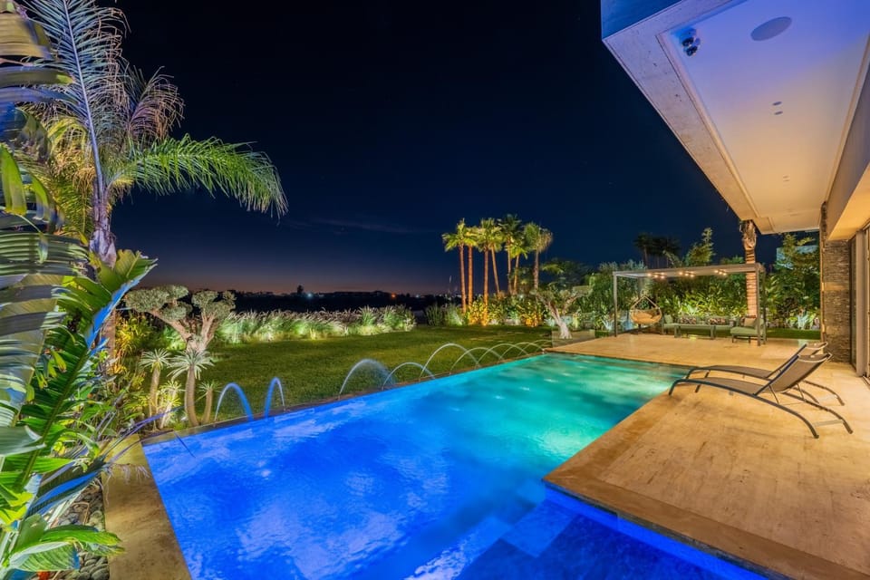 Patio, Night, Pool view, Swimming pool, sunbed