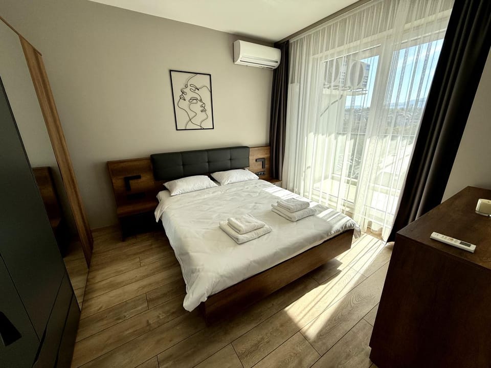 Bed, Photo of the whole room, Bedroom, towels, air conditioner