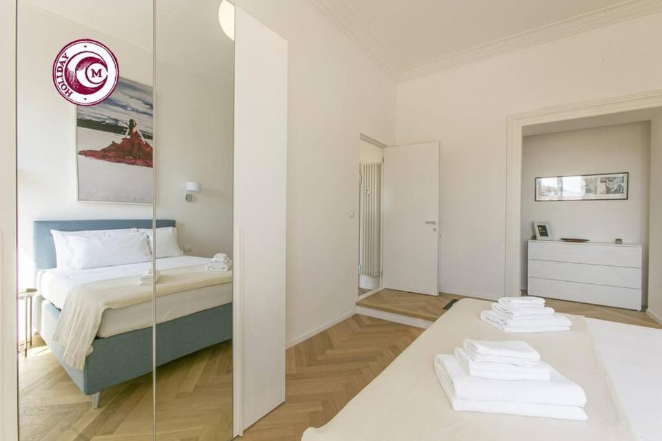 Bed, towels, wardrobe