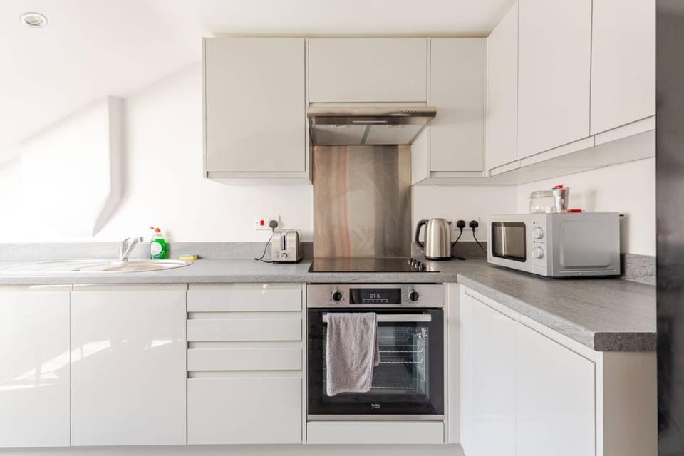 Kitchen or kitchenette, Decorative detail, microwave, oven, stove, toaster, towels, washing machine, kitchen