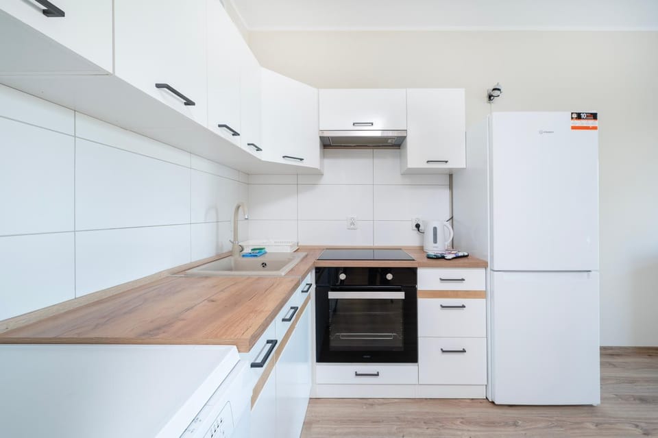 Kitchen or kitchenette, dishwasher, oven, stove