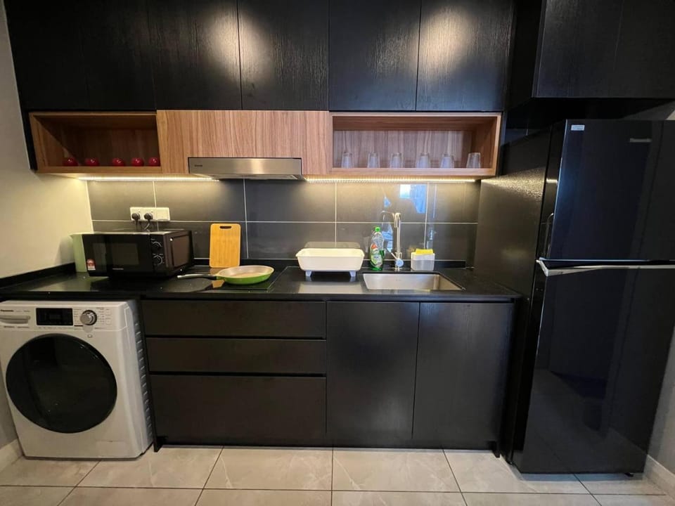Kitchen or kitchenette, microwave, stove, washing machine, kitchen