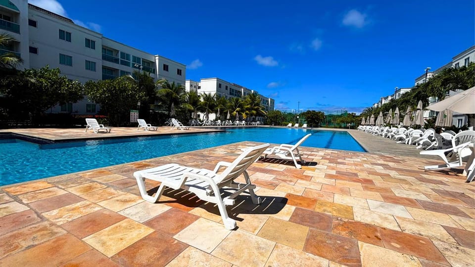 Palm Village Acqua - Flats em Muro Alto por Yolo House in Ipojuca