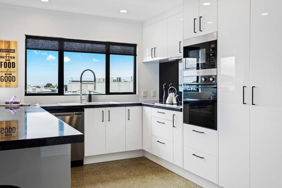 Kitchen or kitchenette, dishwasher, oven, stove, toaster