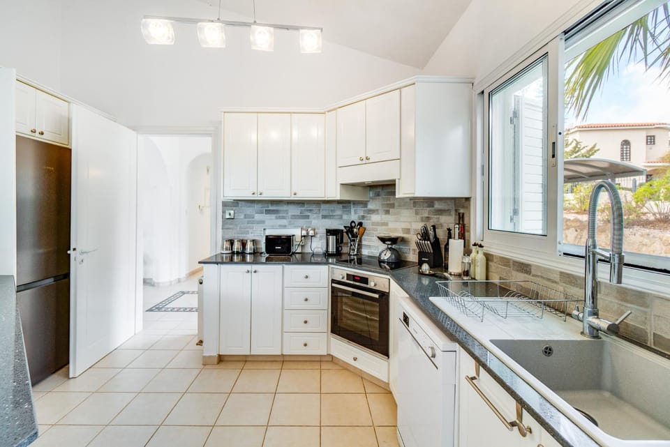 Kitchen or kitchenette, dishwasher, oven, stove