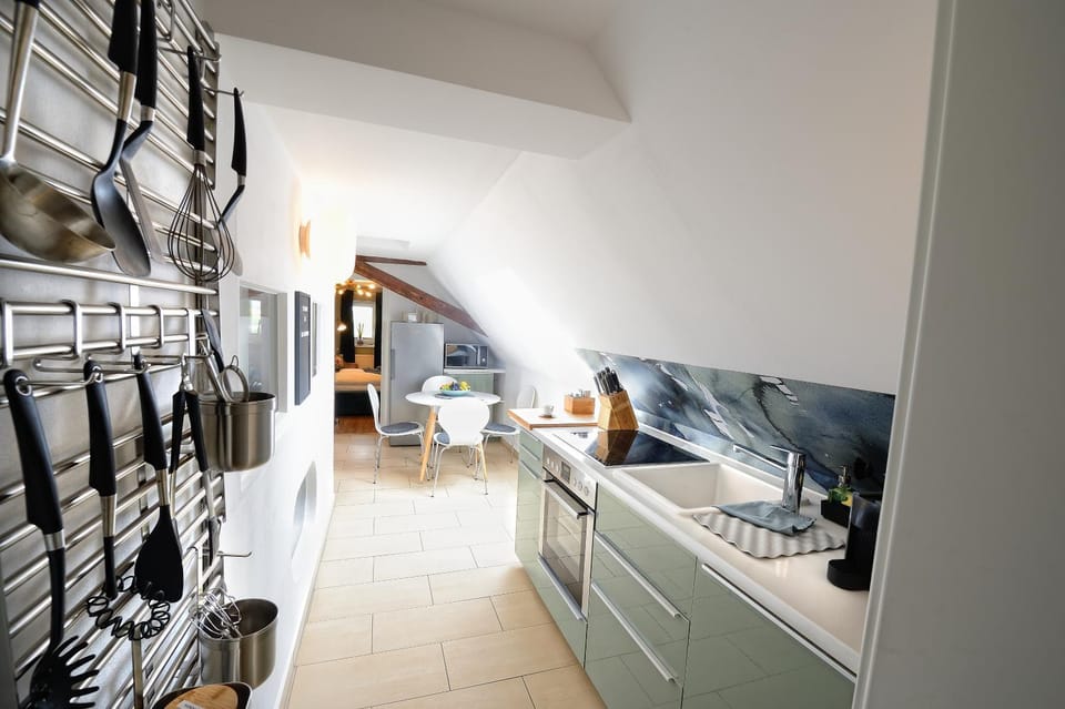 Kitchen or kitchenette, dishwasher, oven, stove