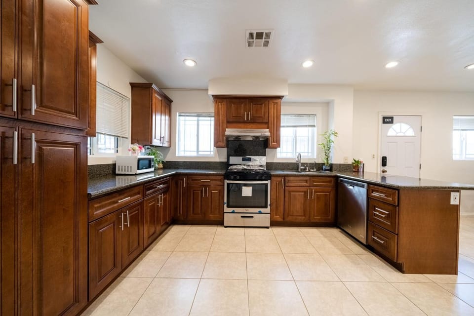 Kitchen or kitchenette, dishwasher, oven, stove, toaster