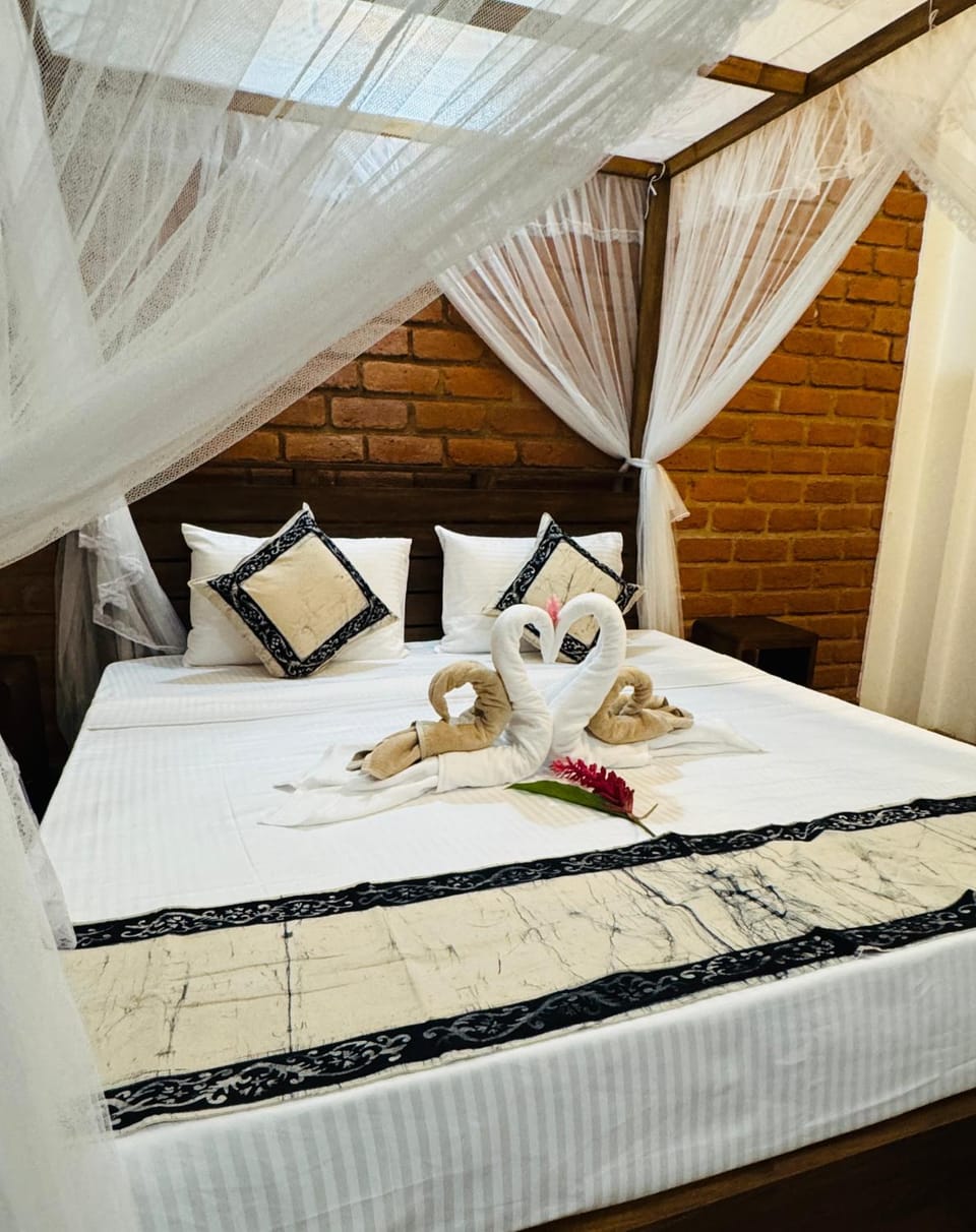 Bed, Bedroom, hair dryier, towels, wardrobe, air conditioner