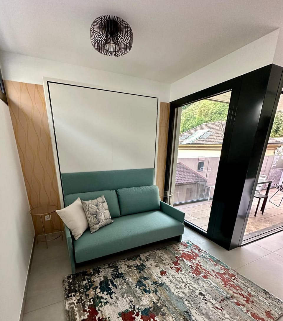 Bed, Living room, Seating area, Bedroom