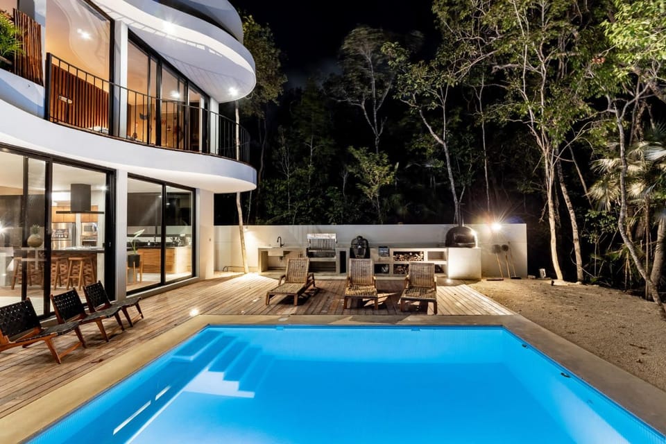 Property building, Patio, Night, Pool view, Swimming pool, sunbed