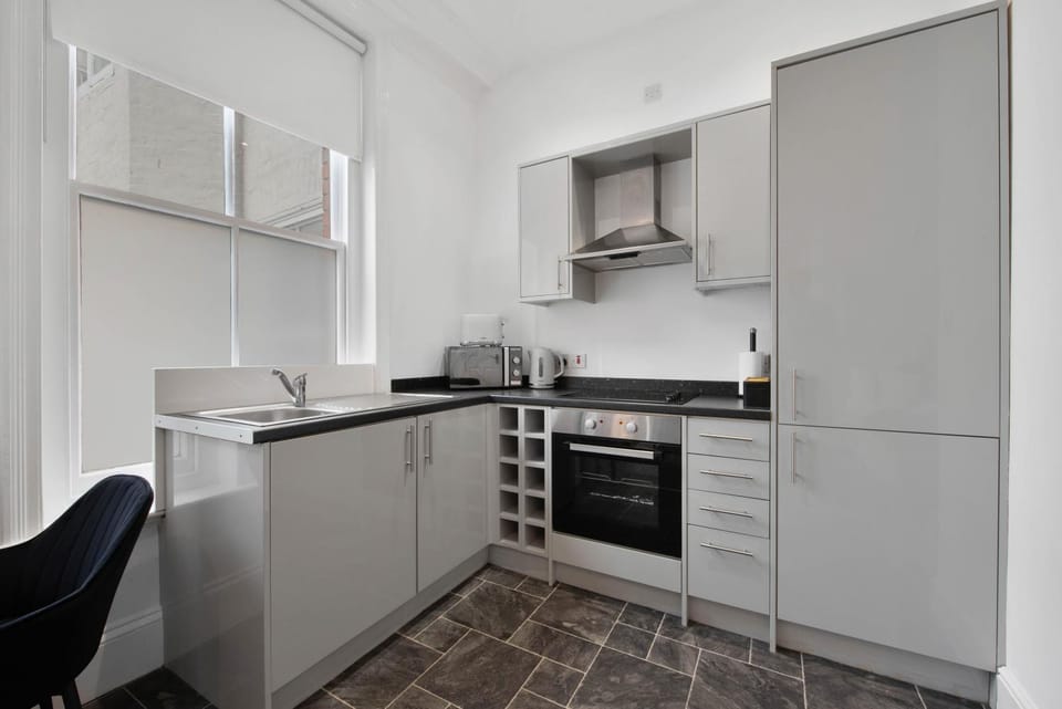 Kitchen or kitchenette, stove, toaster