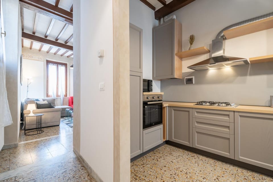 Kitchen or kitchenette, dishwasher, oven, stove