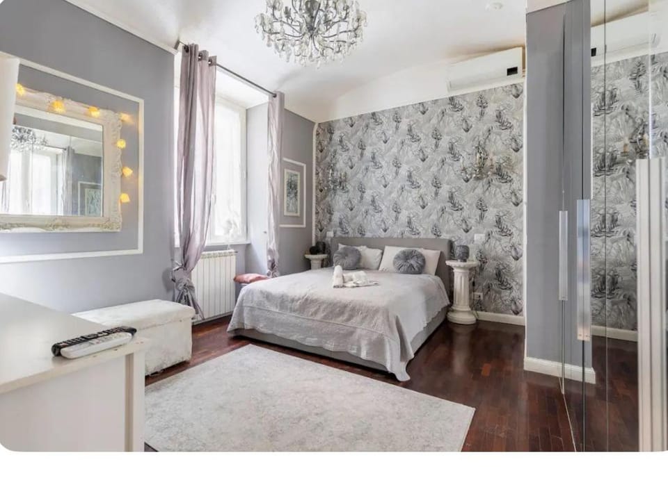 Shower, Toilet, Bed, Bathroom, hair dryier, locker, microwave, towels, air conditioner