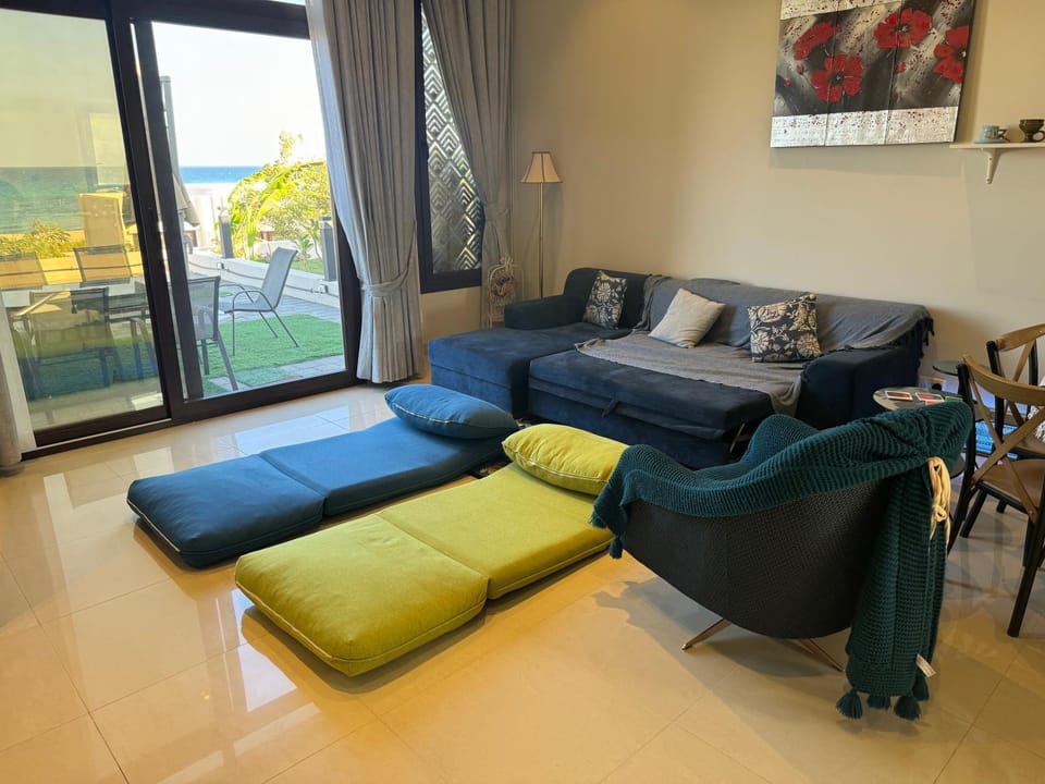 Bed, Living room, Seating area, Sea view