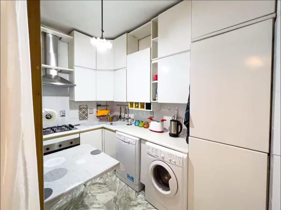 Kitchen or kitchenette, dishwasher, oven, stove, washing machine