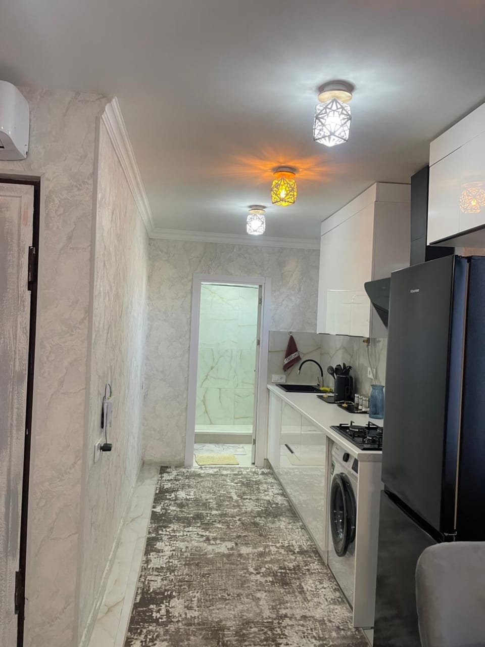 Kitchen or kitchenette, oven, stove, washing machine