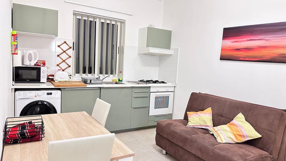 Kitchen or kitchenette, Living room, Seating area, Dining area, oven, stove, toaster