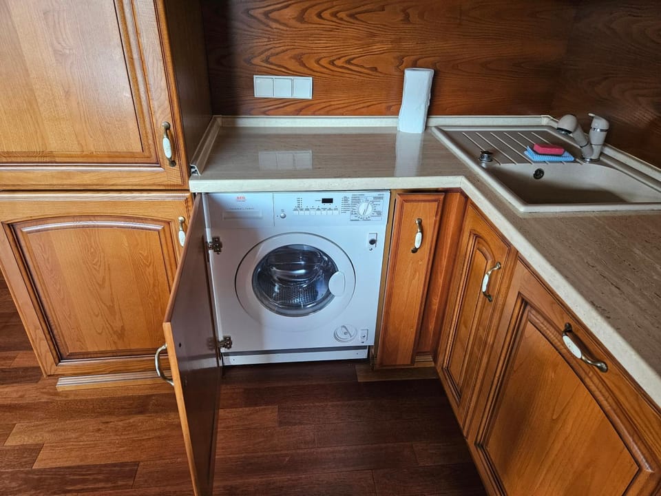 Kitchen or kitchenette, washing machine