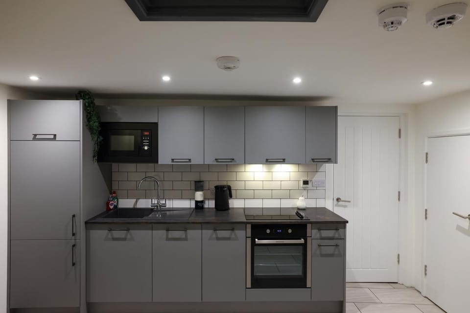 Kitchen or kitchenette, dishwasher, oven, stove, toaster