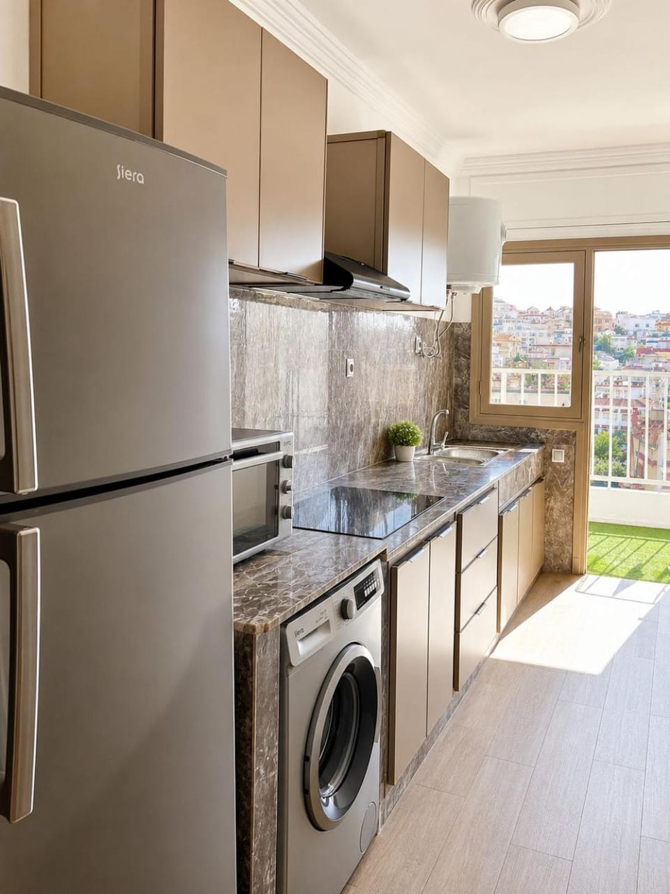 Kitchen or kitchenette, dishwasher, oven, stove, washing machine
