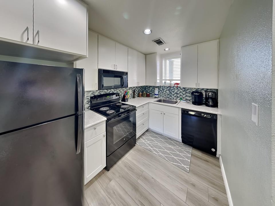 Kitchen or kitchenette, dishwasher, microwave, oven, stove, kitchen