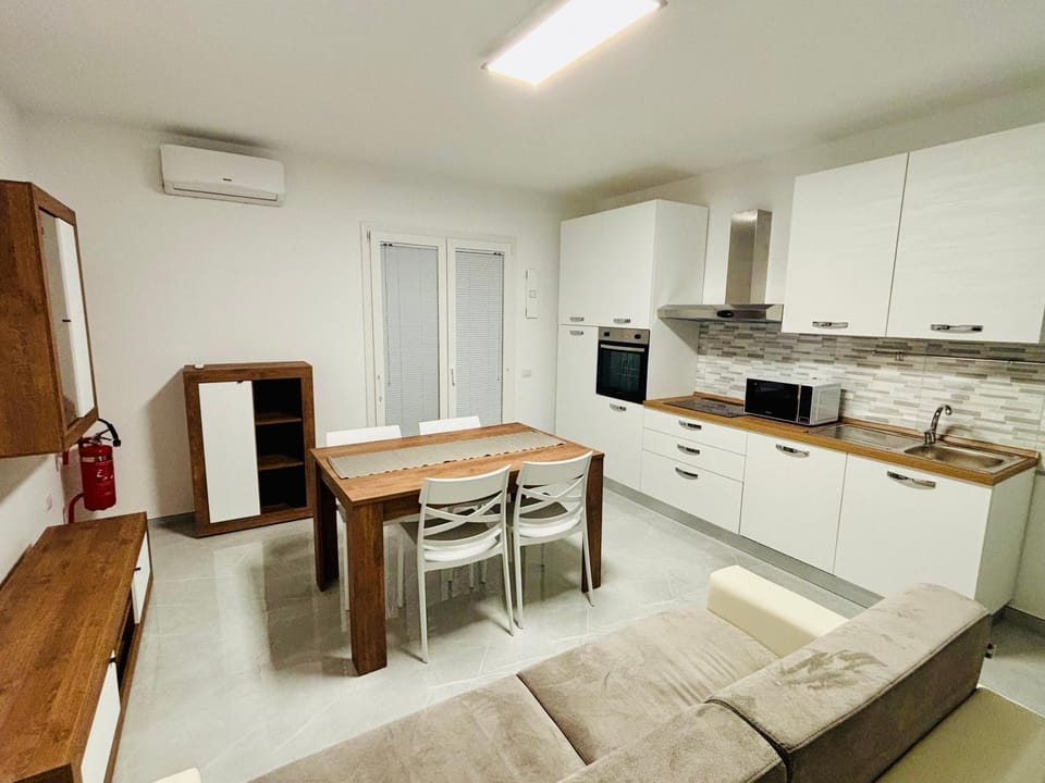 Kitchen or kitchenette, Dining area, dishwasher, microwave, oven, stove, air conditioner