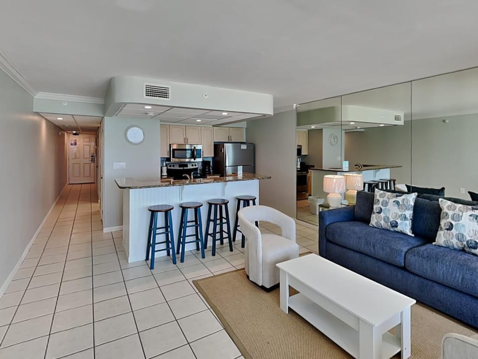 Kitchen or kitchenette, Living room, Seating area, furniture, microwave, oven, stove, air conditioner