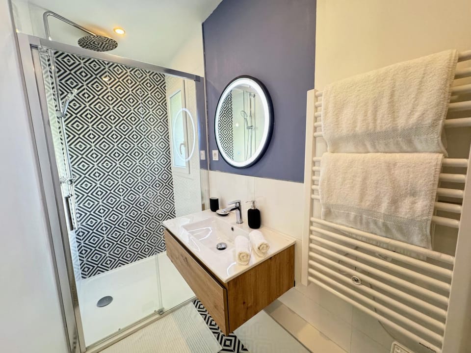 Shower, Bathroom, hair dryier, towels, wardrobe