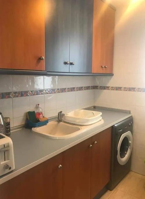 Kitchen or kitchenette, washing machine