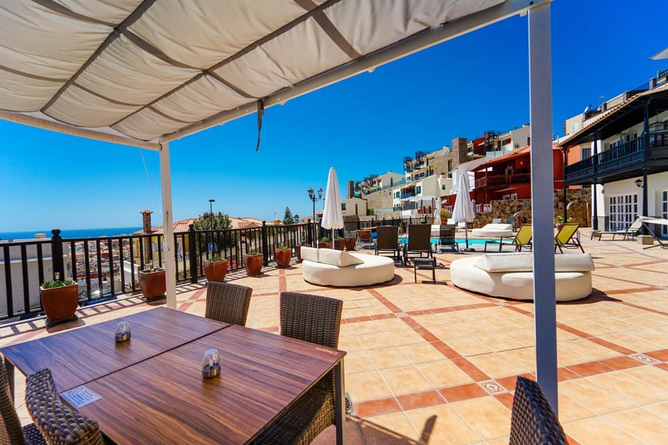 Property building, Patio, Day, View (from property/room), Balcony/Terrace, Seating area, City view, Sea view
