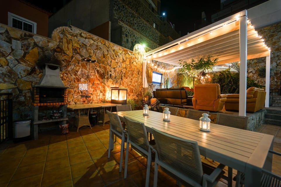 Patio, Night, BBQ facilities, Seating area, Dining area