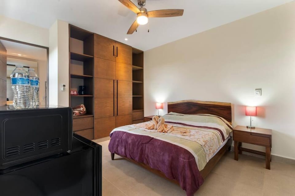 Bed, Photo of the whole room, Bedroom, microwave, safe, wardrobe, air conditioner
