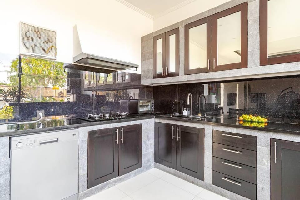 Kitchen or kitchenette, dishwasher, oven, stove