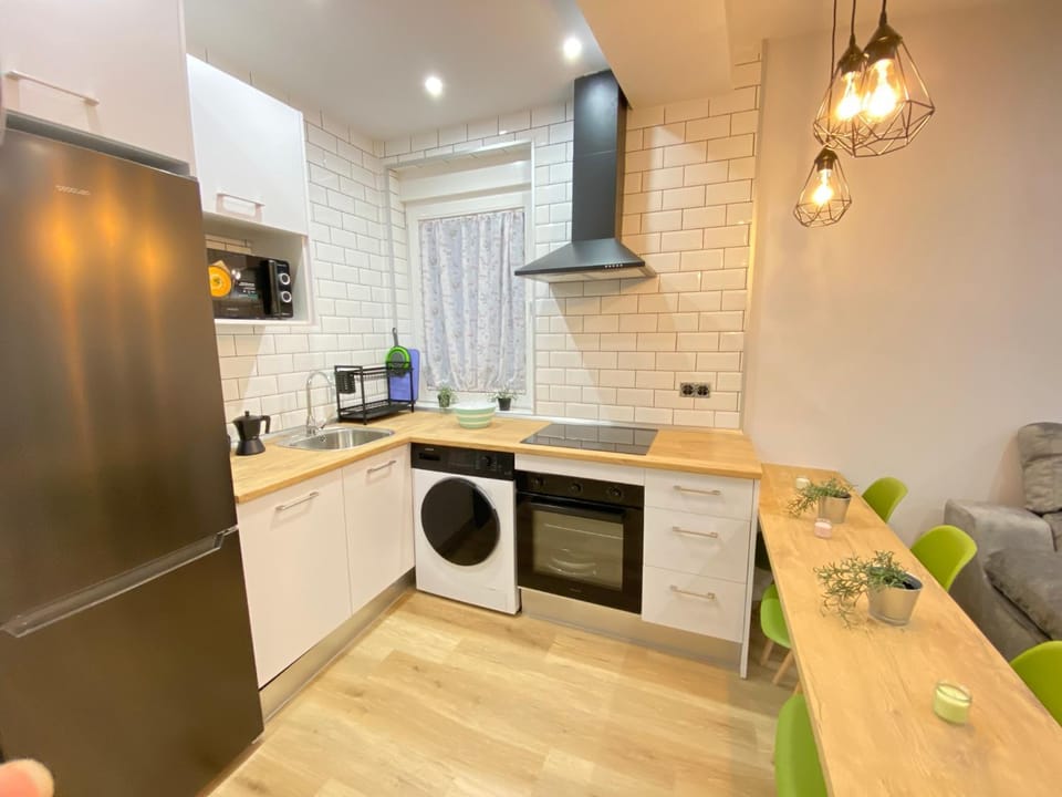 Kitchen or kitchenette, dishwasher, oven, stove, toaster, washing machine