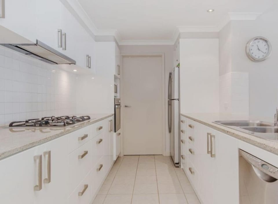 Kitchen or kitchenette, dishwasher, oven, stove