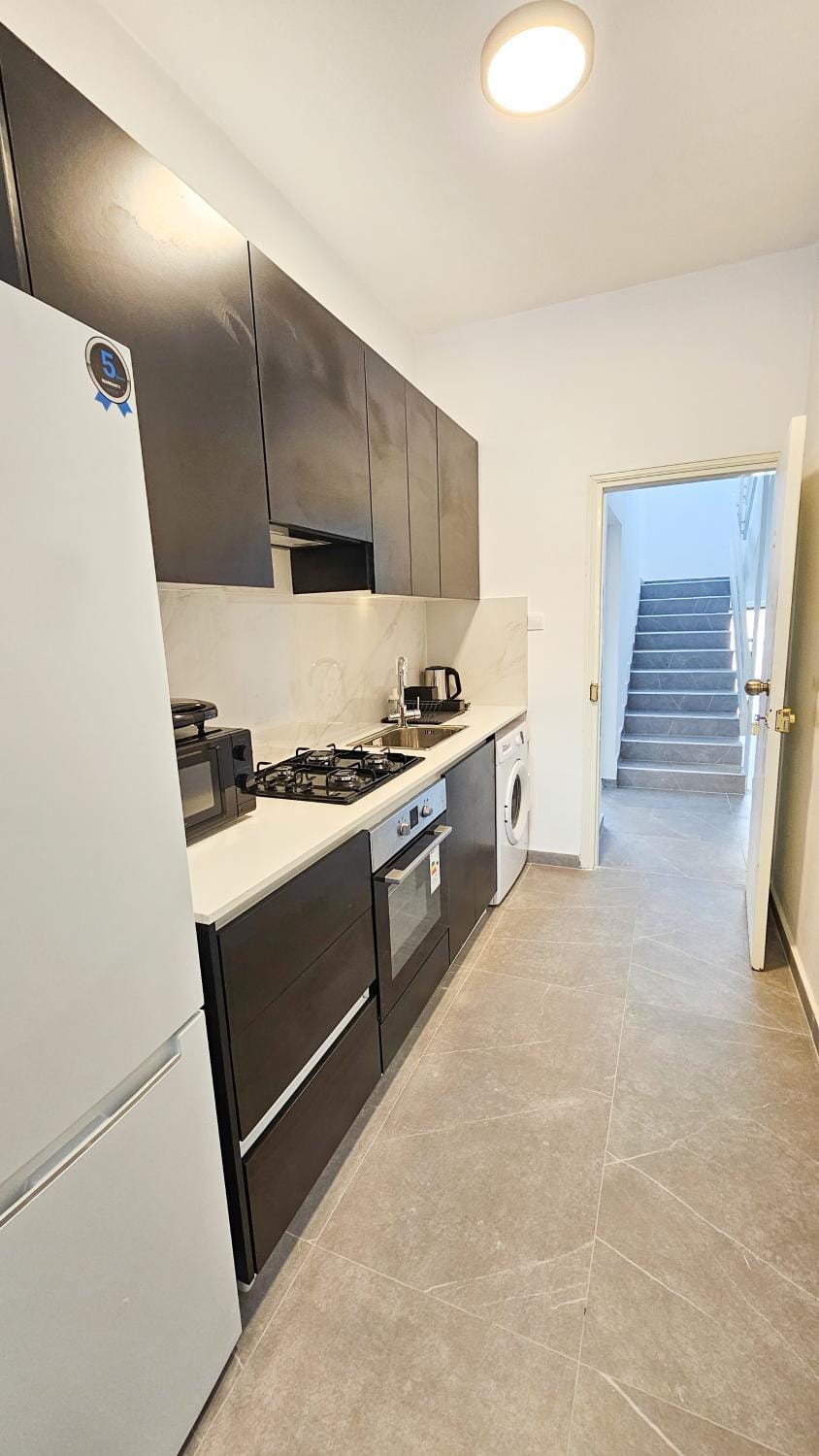 Kitchen or kitchenette, oven, stove