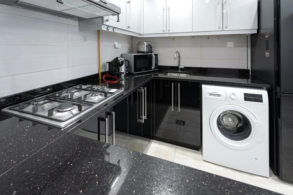 Kitchen or kitchenette, stove, washing machine