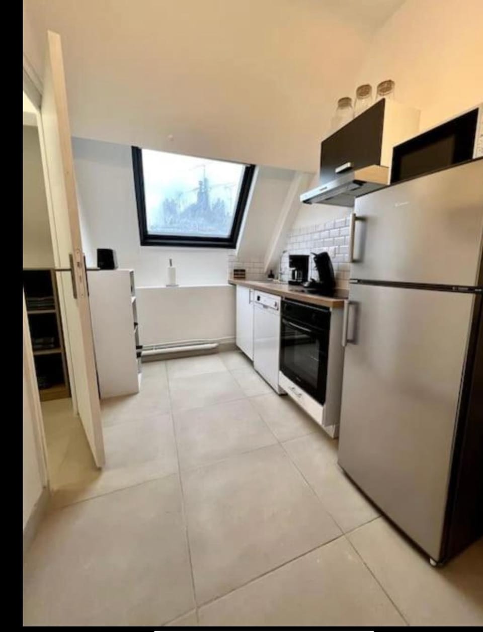 Kitchen or kitchenette, dishwasher, microwave, oven, stove, toaster