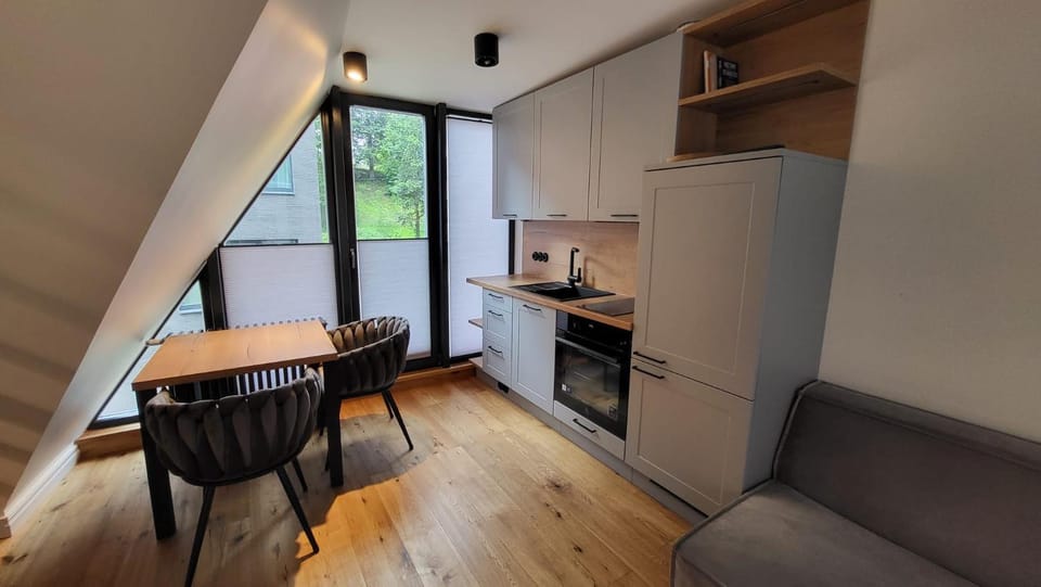 Kitchen or kitchenette, Living room, Seating area, stove
