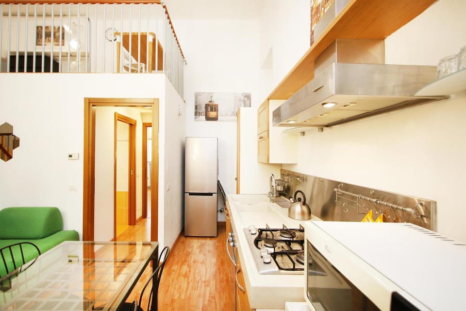 Kitchen or kitchenette, dishwasher, oven, stove